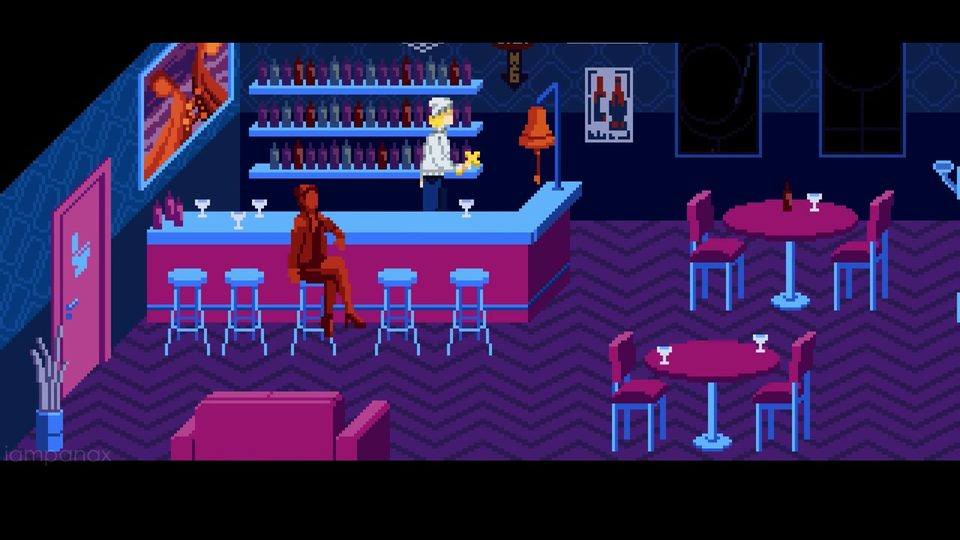 Julia behind the counter of the purple Septimo Arte bar, with a bell on a stand at the end of the counter and shelves of bottles behind her